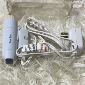 Tiny travel blow dryer. Super small and compact.